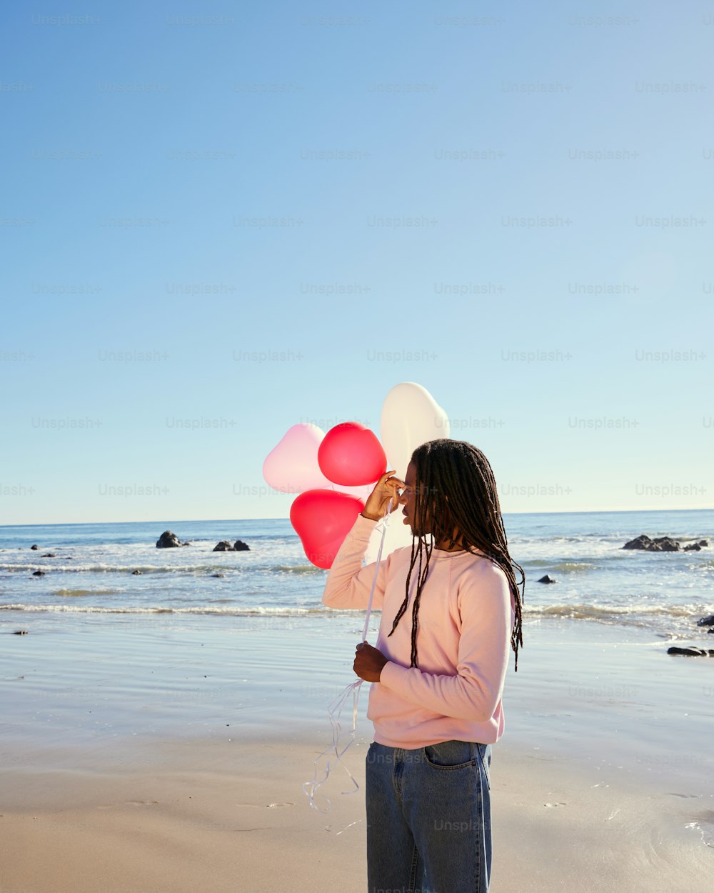 a man standing on a sandy beach