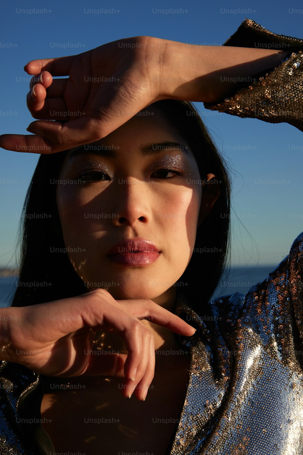 a close up of a person with a finger on their head