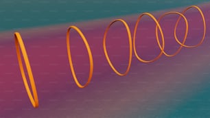 Eine Gruppe orangefarbener Spiralen auf blauem und rosa Hintergrund