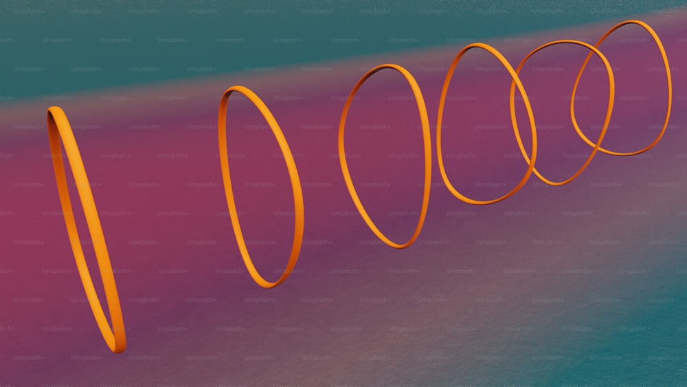 a group of orange spirals on a blue and pink background