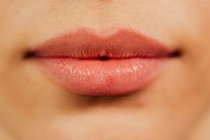 a close up of a woman's lips with red lipstick