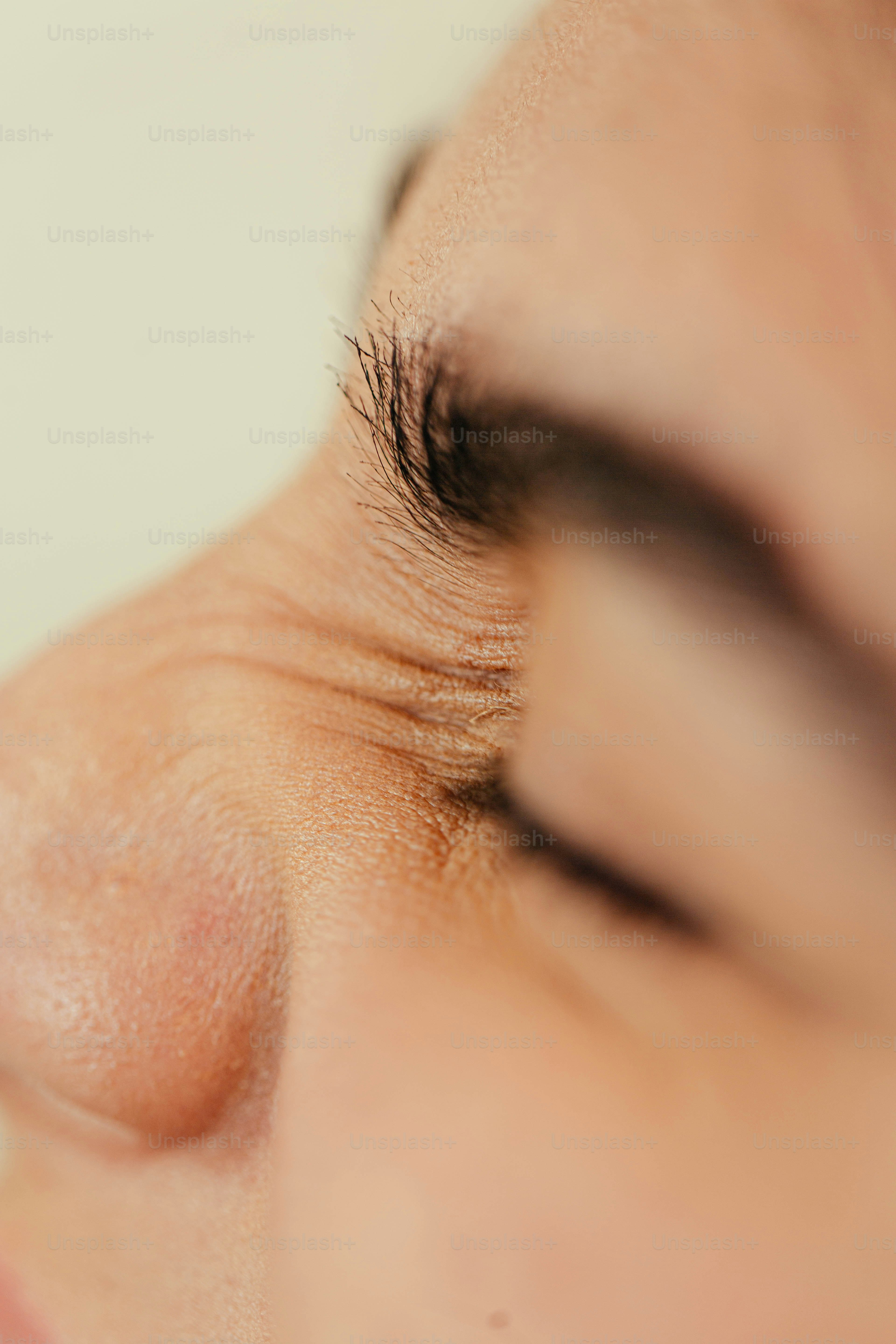 a close up of a woman's nose with a toothbrush in her mouth