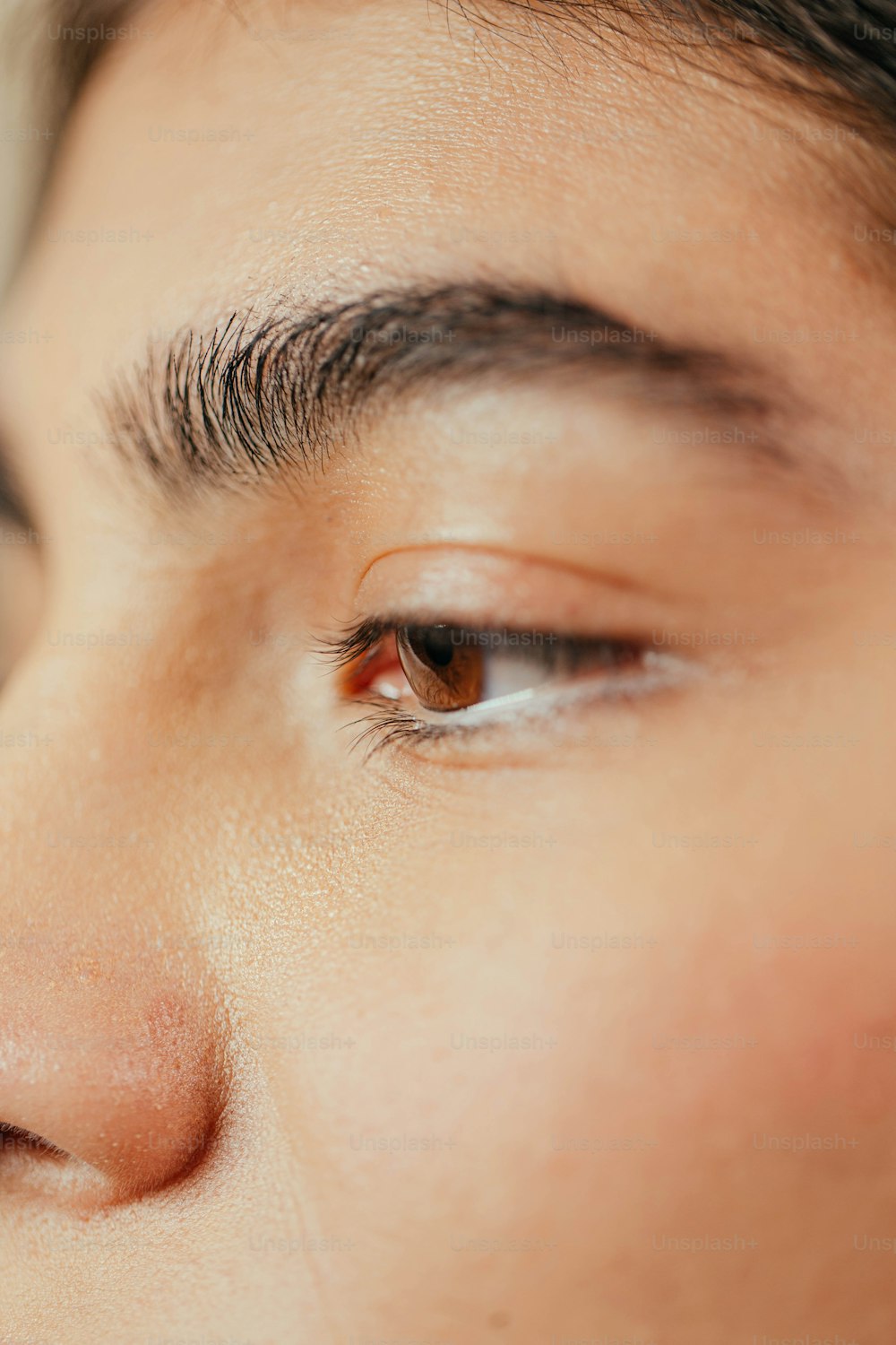 a close up of a woman's eye and nose