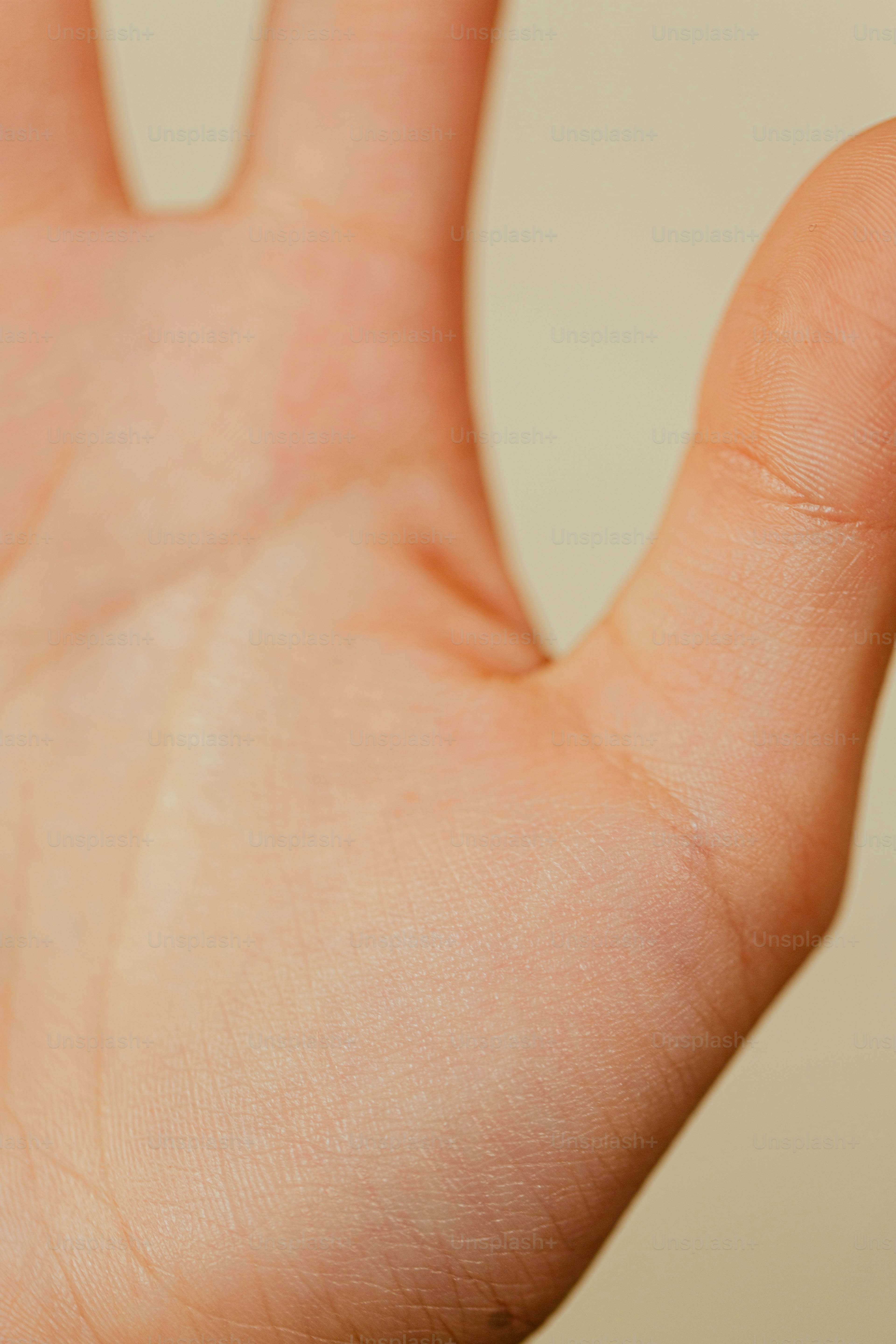 a close up of a person's hand holding a cell phone