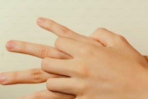 a close up of a person's hand holding something