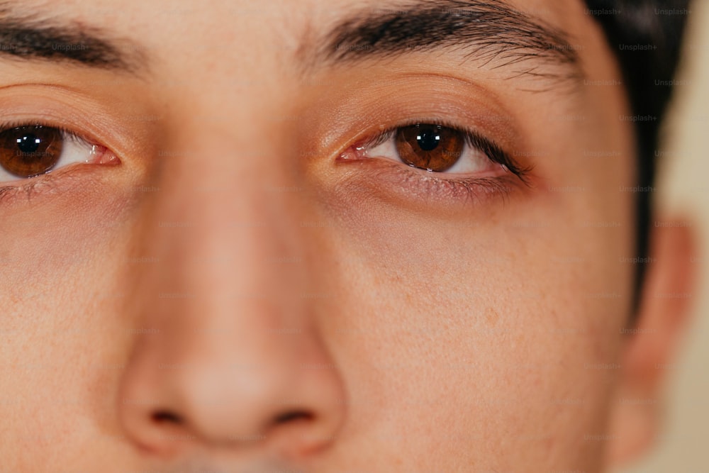 a close up of a person with brown eyes