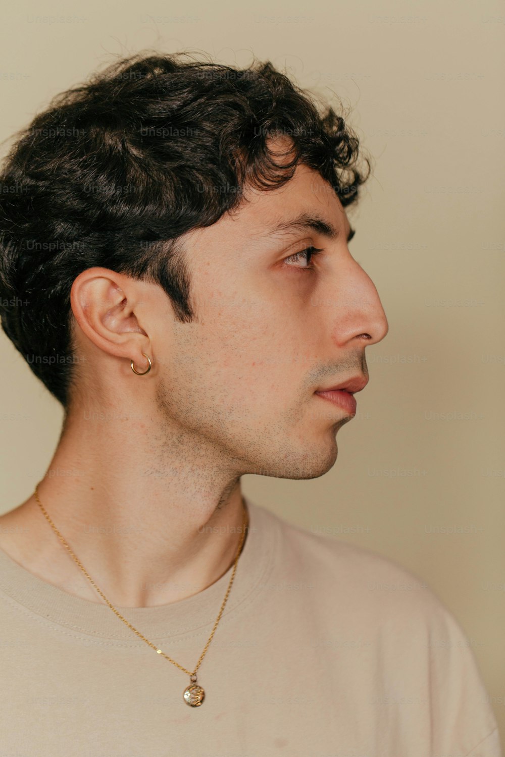 a man with a necklace on his neck