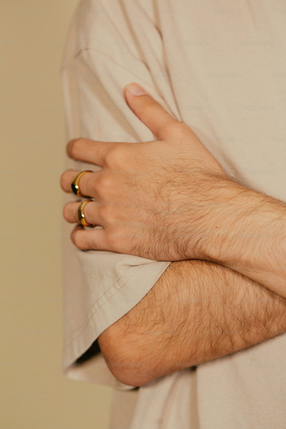 a close up of a person wearing two rings