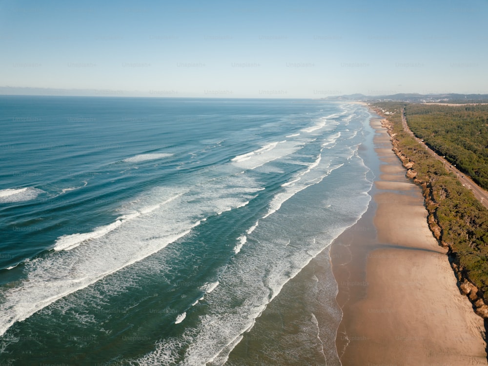 an aerial view of a beach and ocean