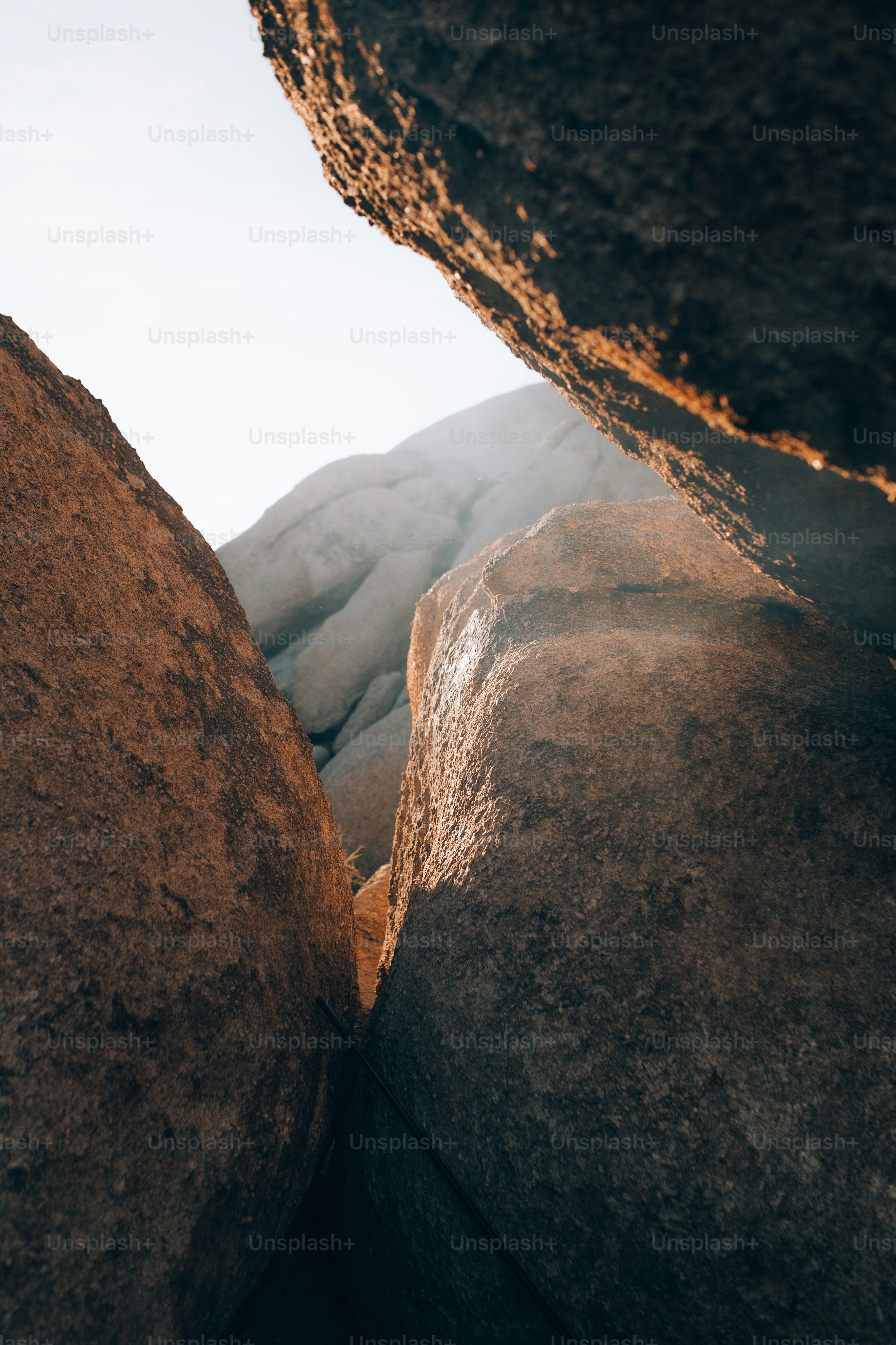 a rock formation with a sky in the background