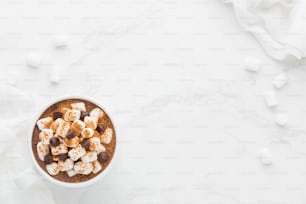 a cup of hot chocolate with marshmallows in it