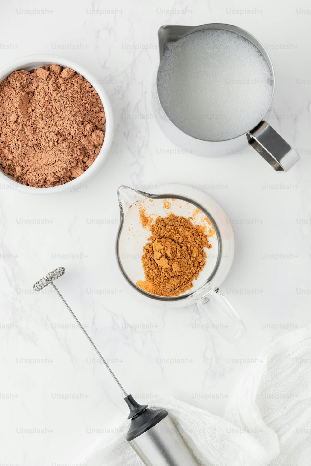 a bowl of powder and a bowl of cocoa on a table