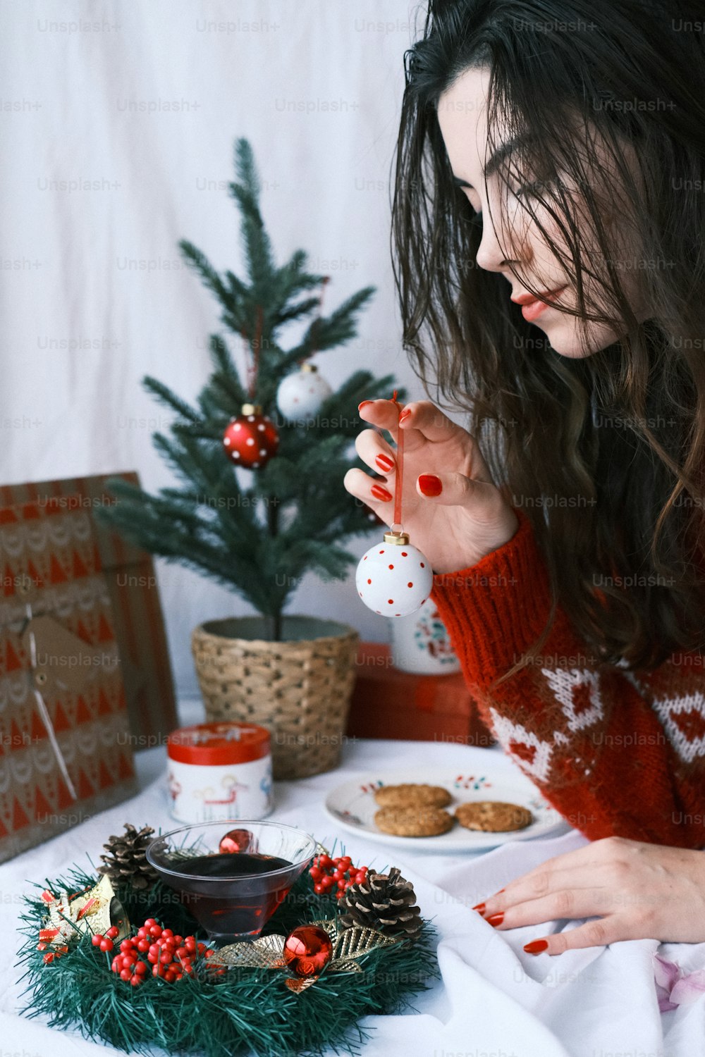 a woman sitting at a table with a plate of food