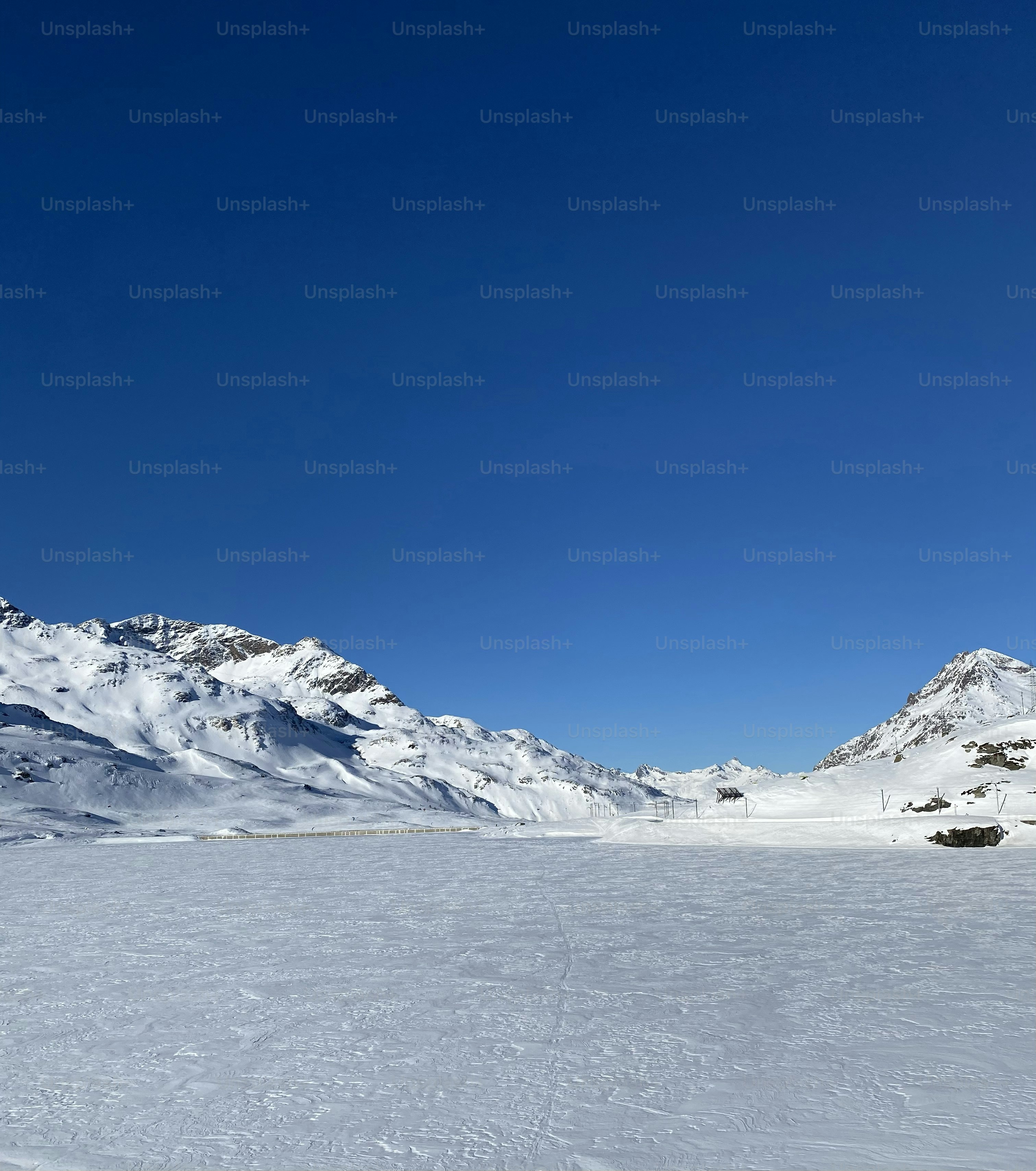 a person riding skis on a snowy surface