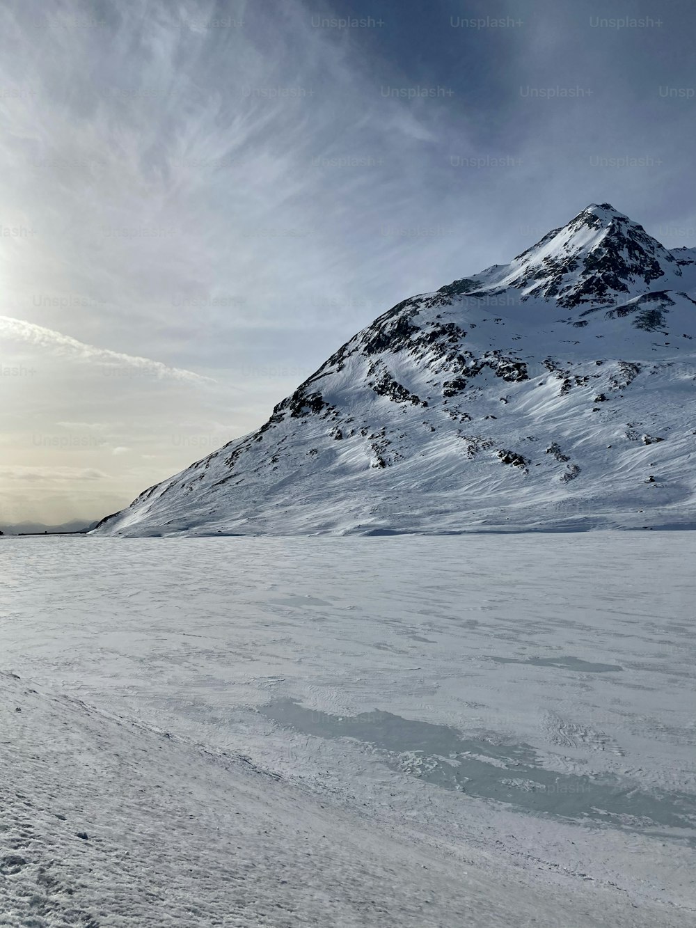 a person walking across a snow covered field