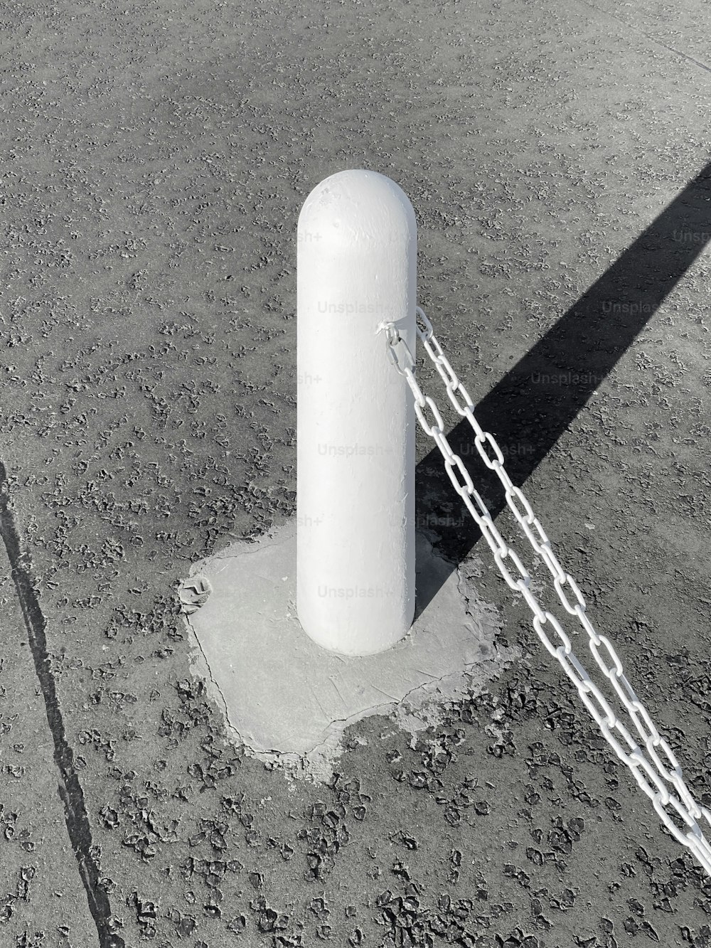 a large white object chained to a pole