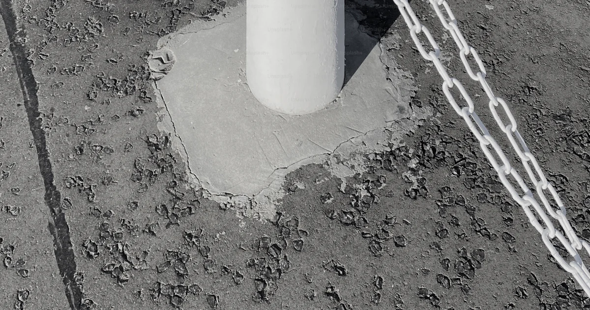 Object Chained A large white object chained to a pole photo – Outdoors Image on Unsplash