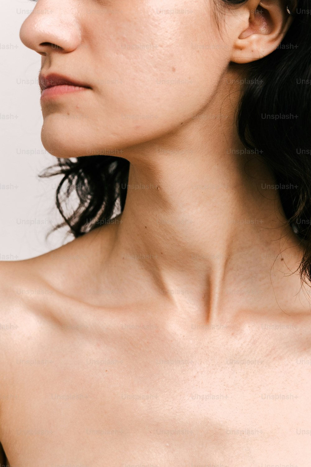 a close up of a woman's neck and shoulder