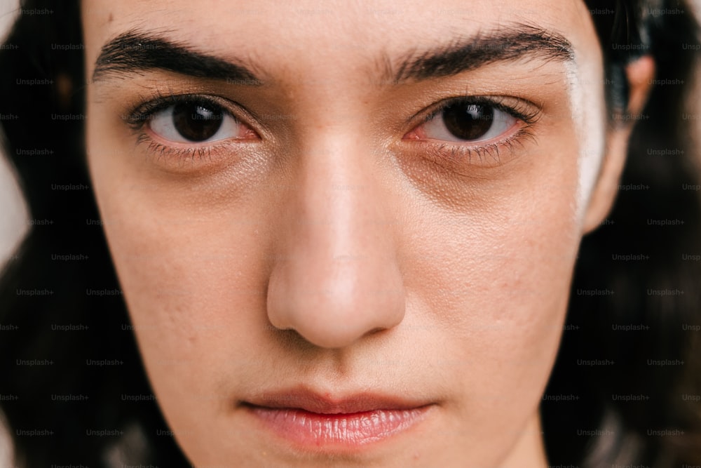 a close up of a person with brown eyes