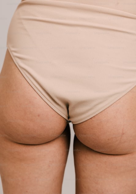 A woman in a tan panties showing her butt photo – Bottom Image on Unsplash