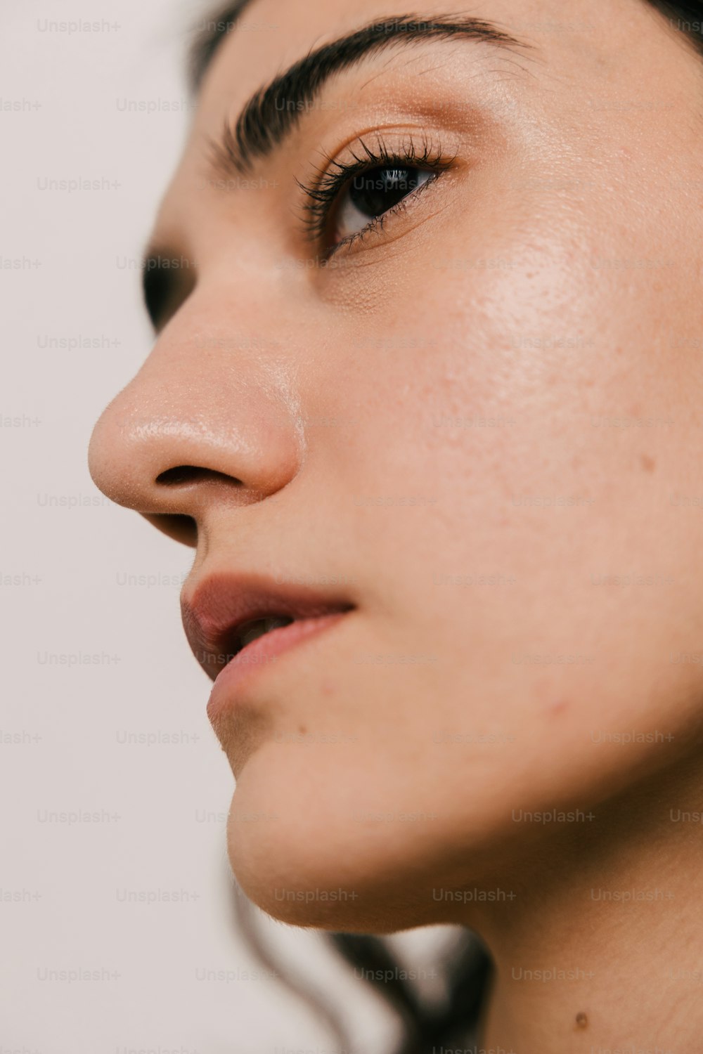 a close up of a woman's face wearing earrings