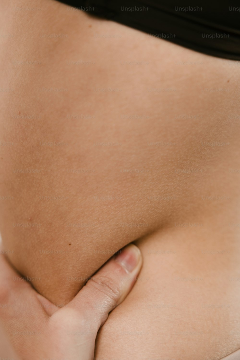 a close up of a woman's butt with her hand on her hip
