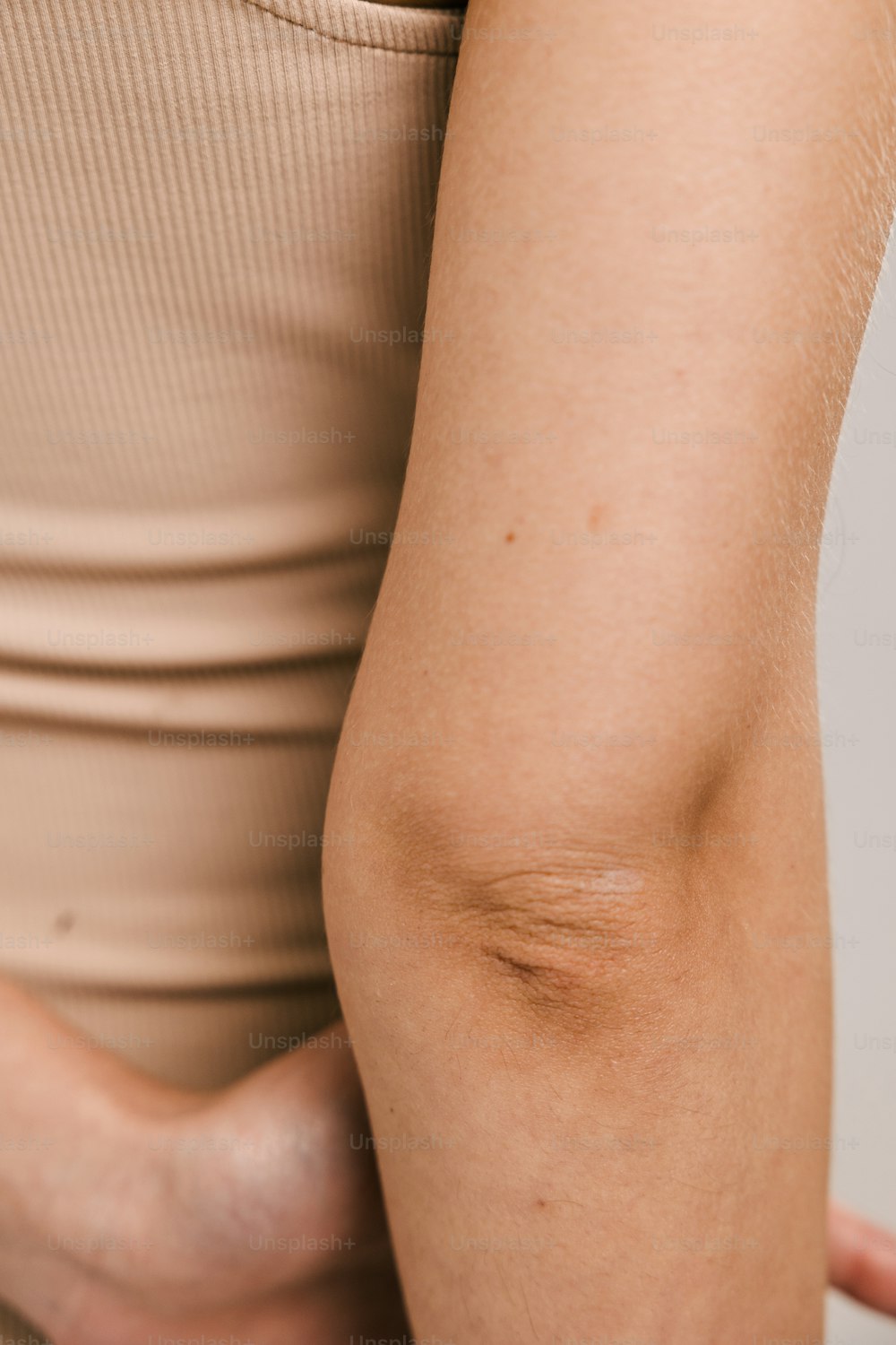 a woman's arm with a small patch of skin on it