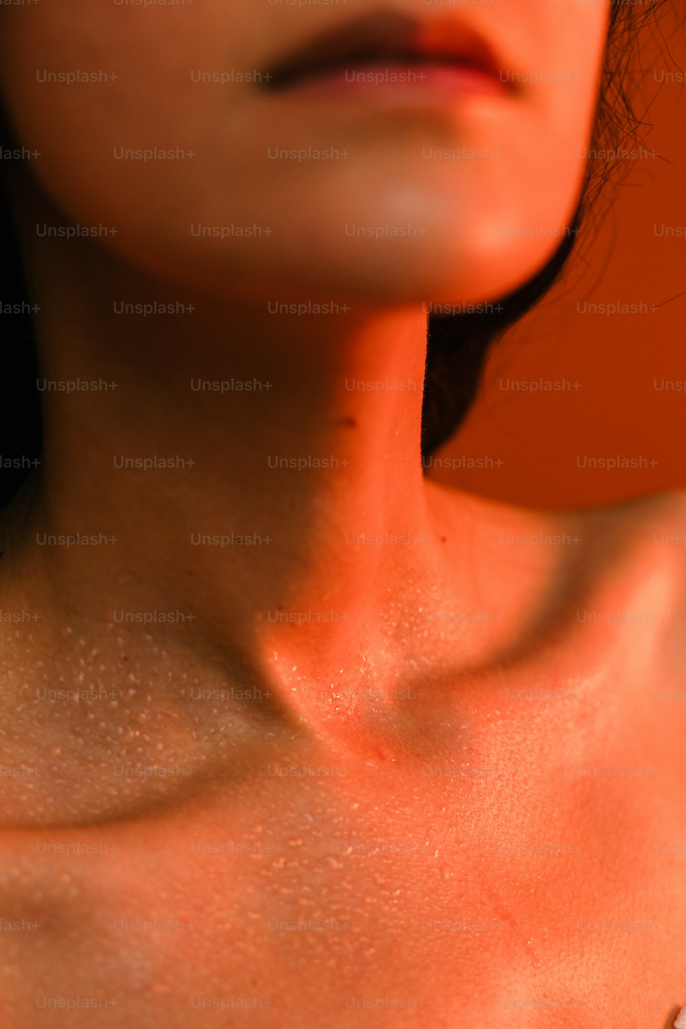 a close up of a woman's chest and neck
