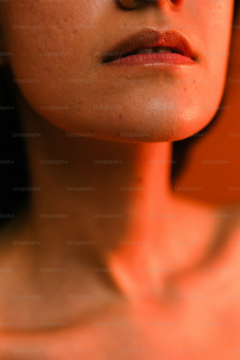 a close up of a woman's face and neck