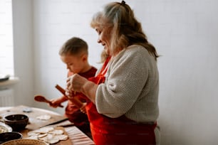 a woman and a child are making cookies