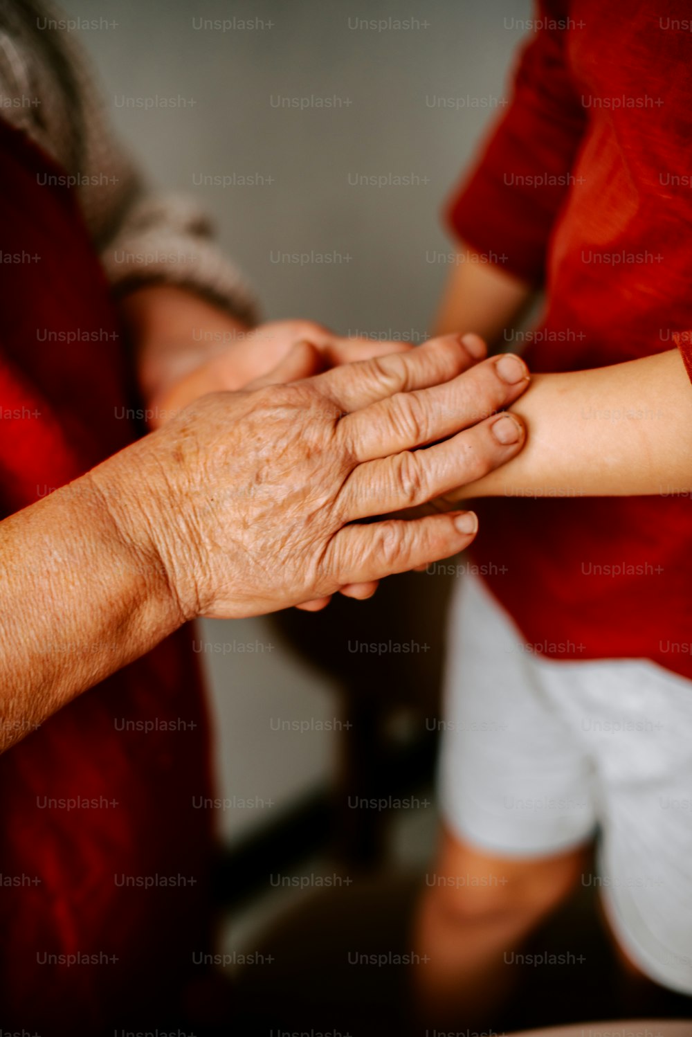 a close up of a person holding another person's hand
