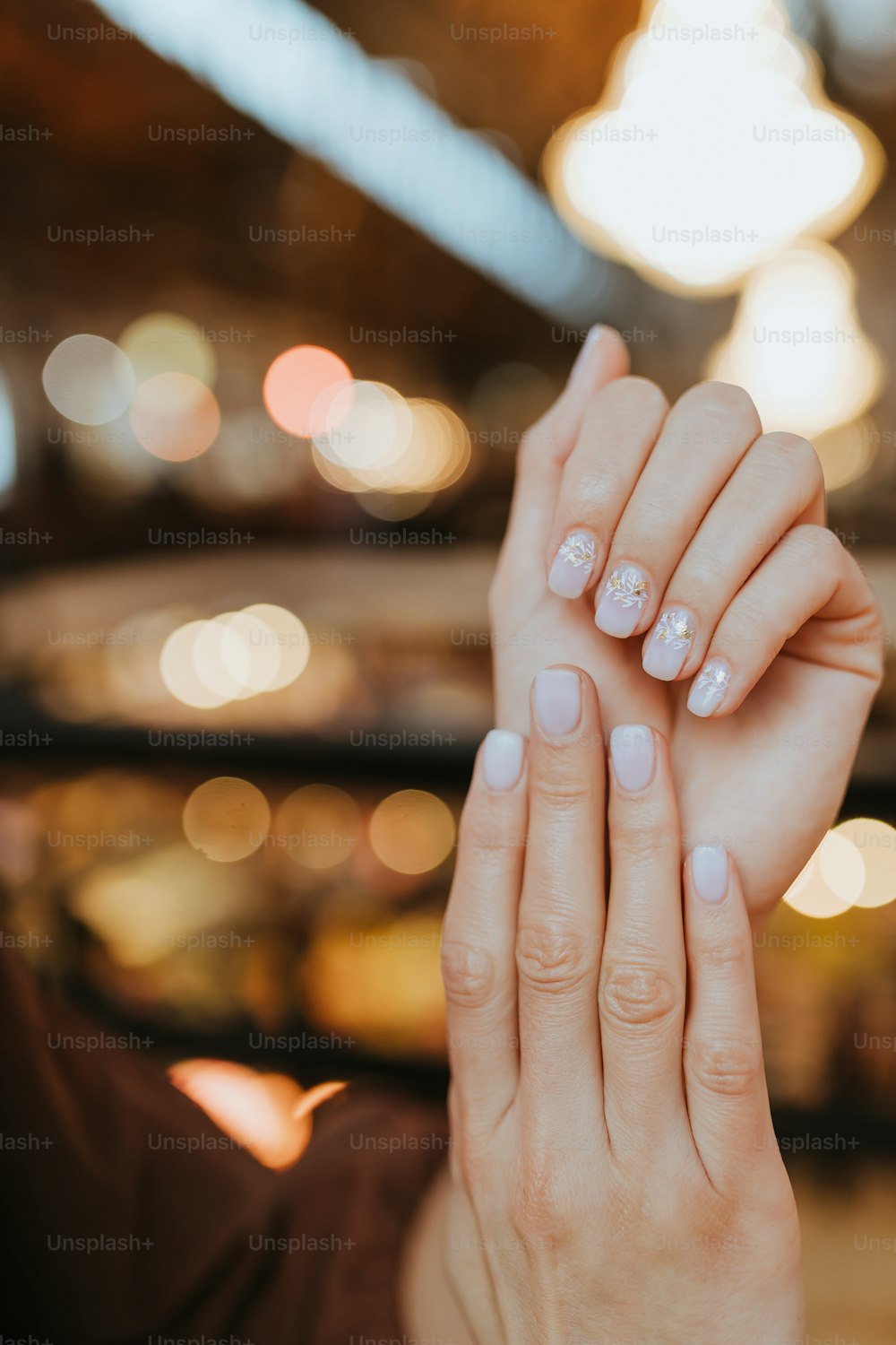 a woman holding her hands up in the air