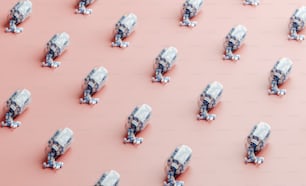 a large group of toy trucks on a pink surface