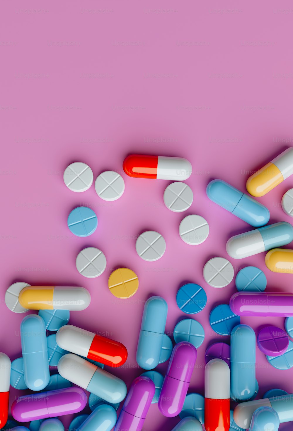 a pile of pills on a pink background