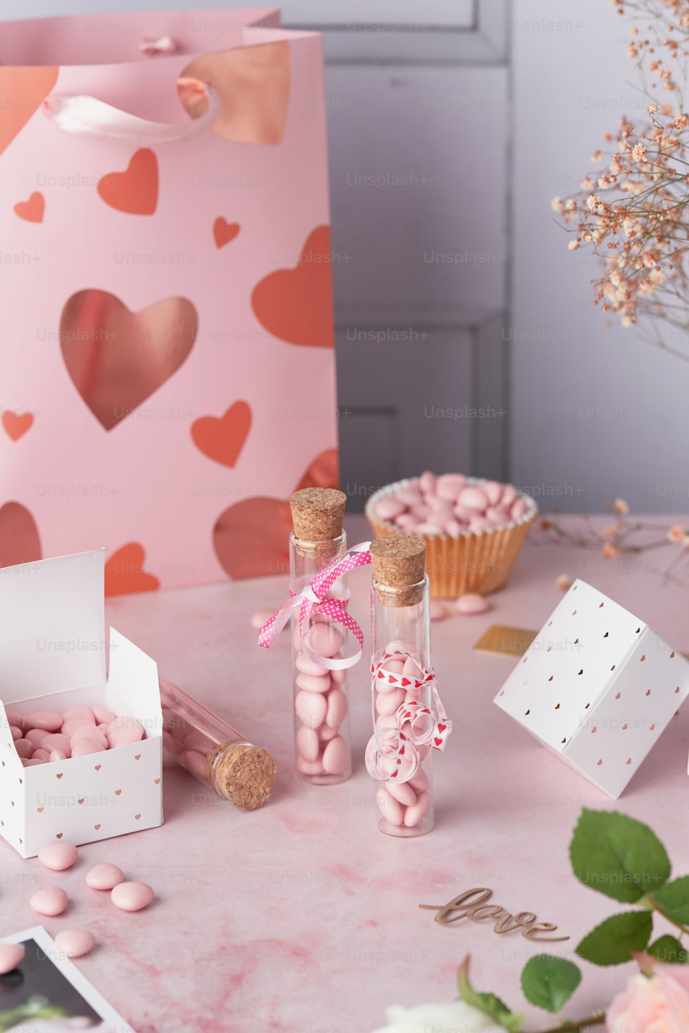 a table topped with boxes filled with candy