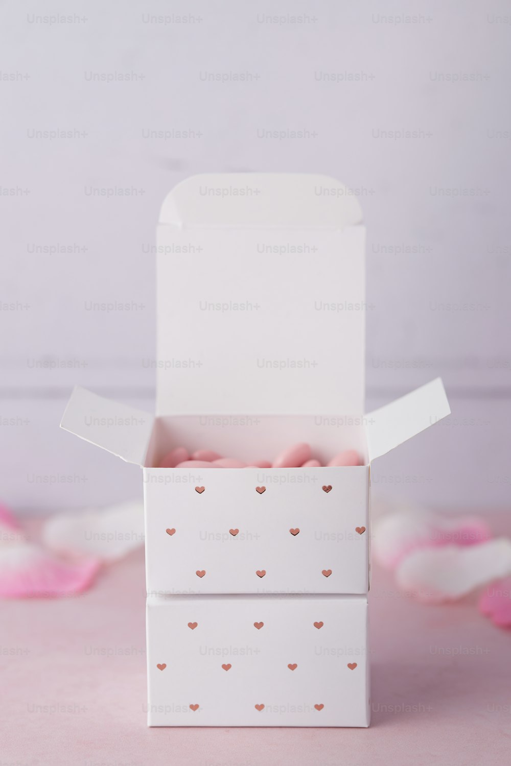 a small white box with hearts on it