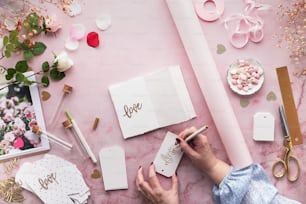 a person writing on a piece of paper