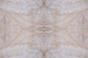 a marbled background with a gold and white design