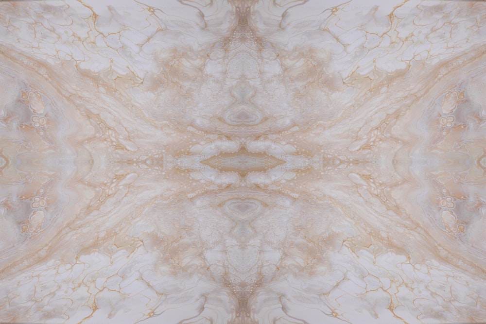 a marbled background with a gold and white design