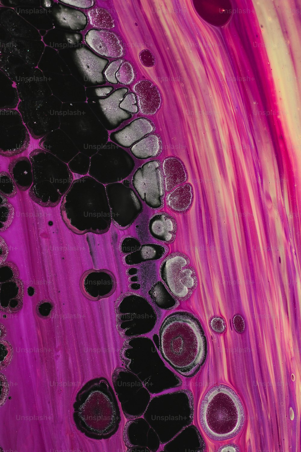 a close up of a purple and black substance
