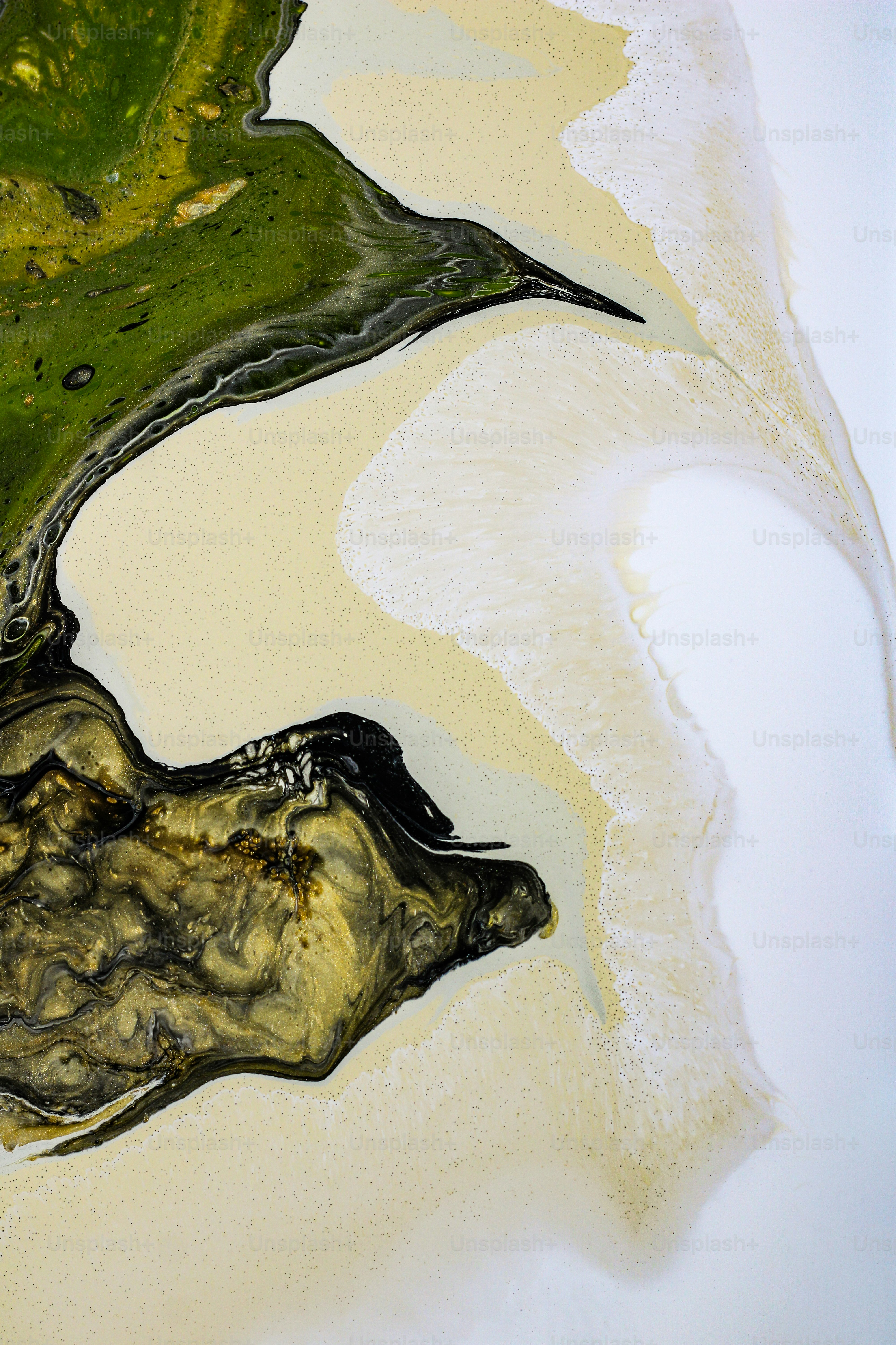 a painting of a green leaf on a white surface