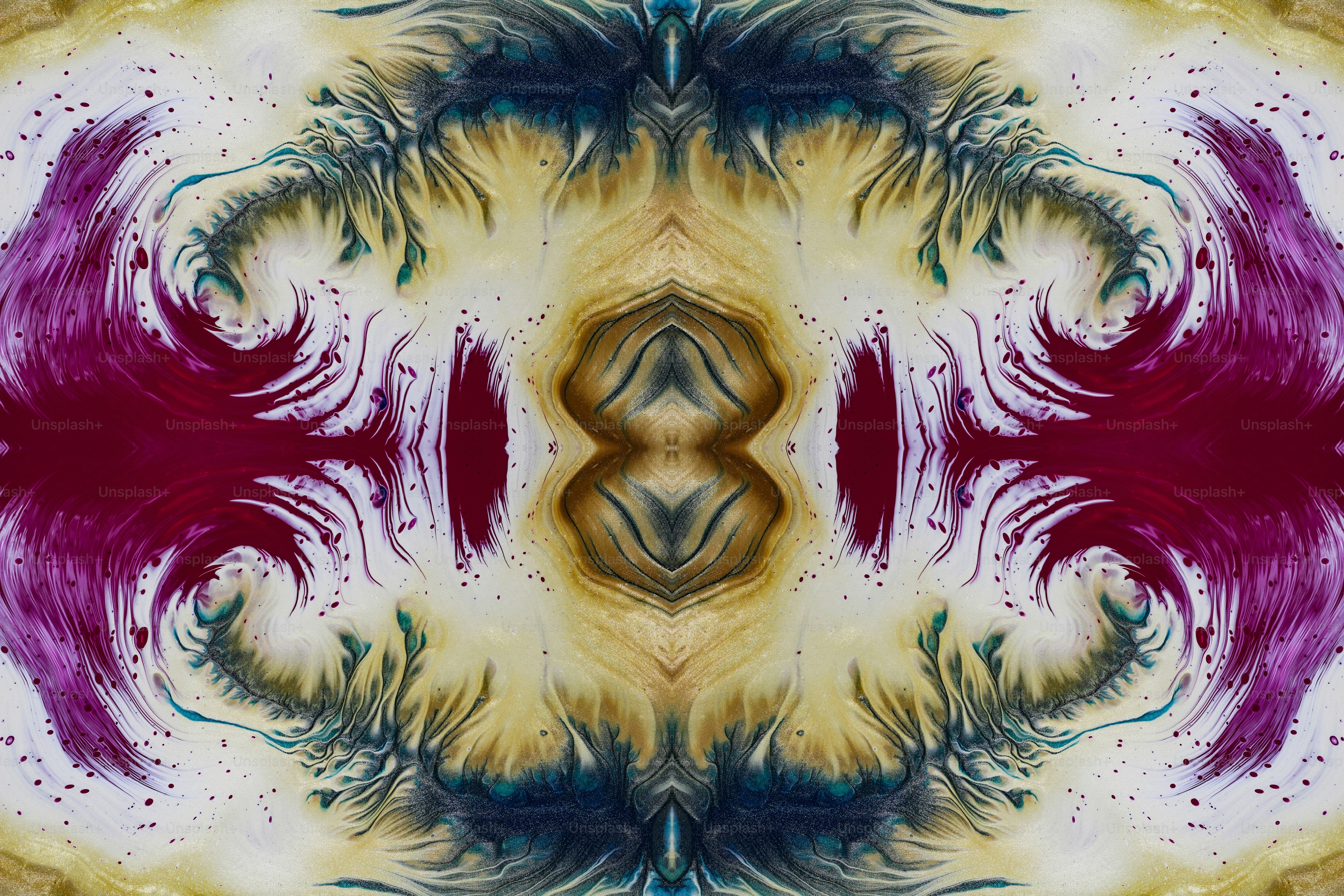 an abstract image of a flower with red and purple petals