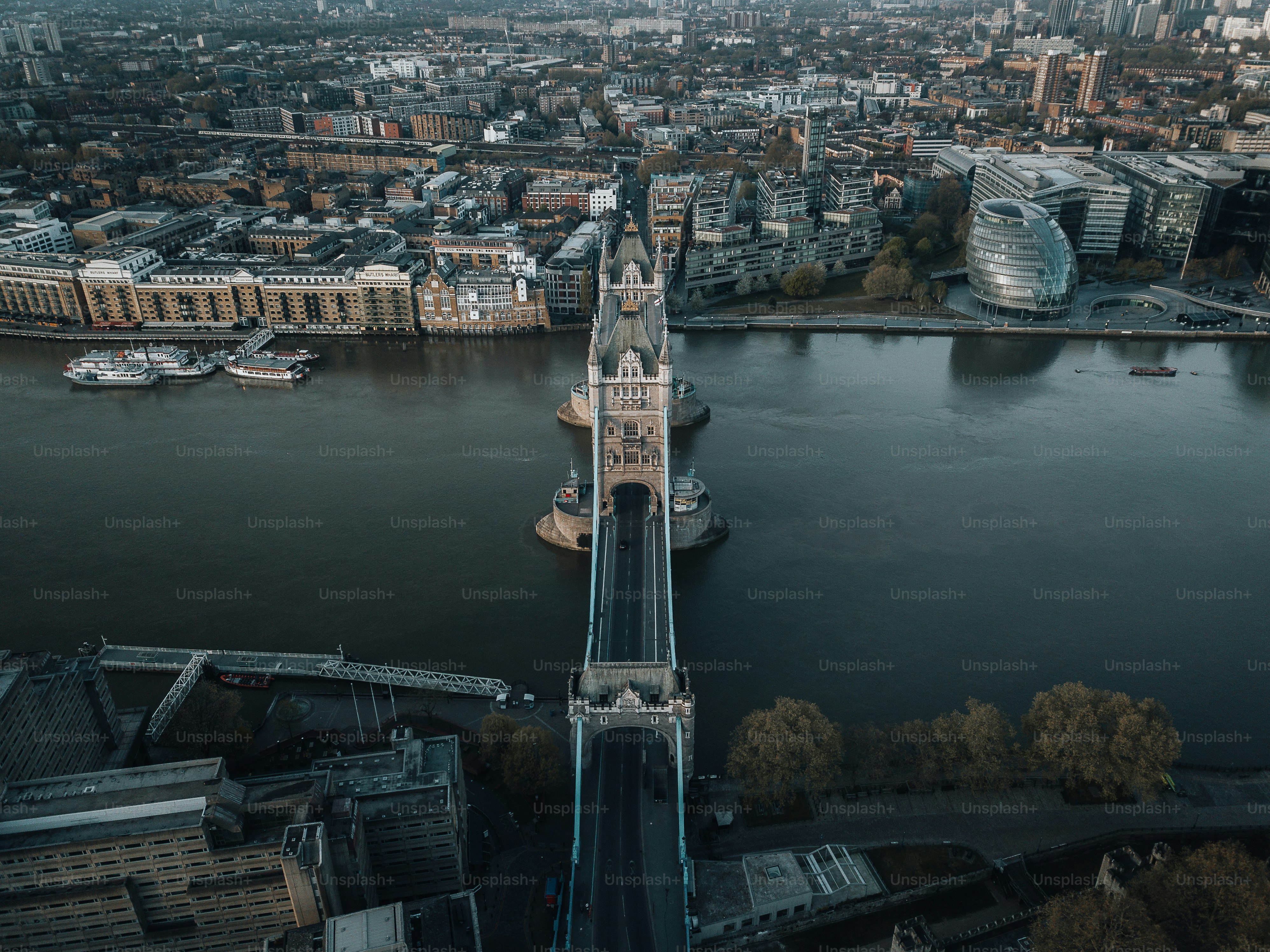 an aerial view of a bridge over a body of water