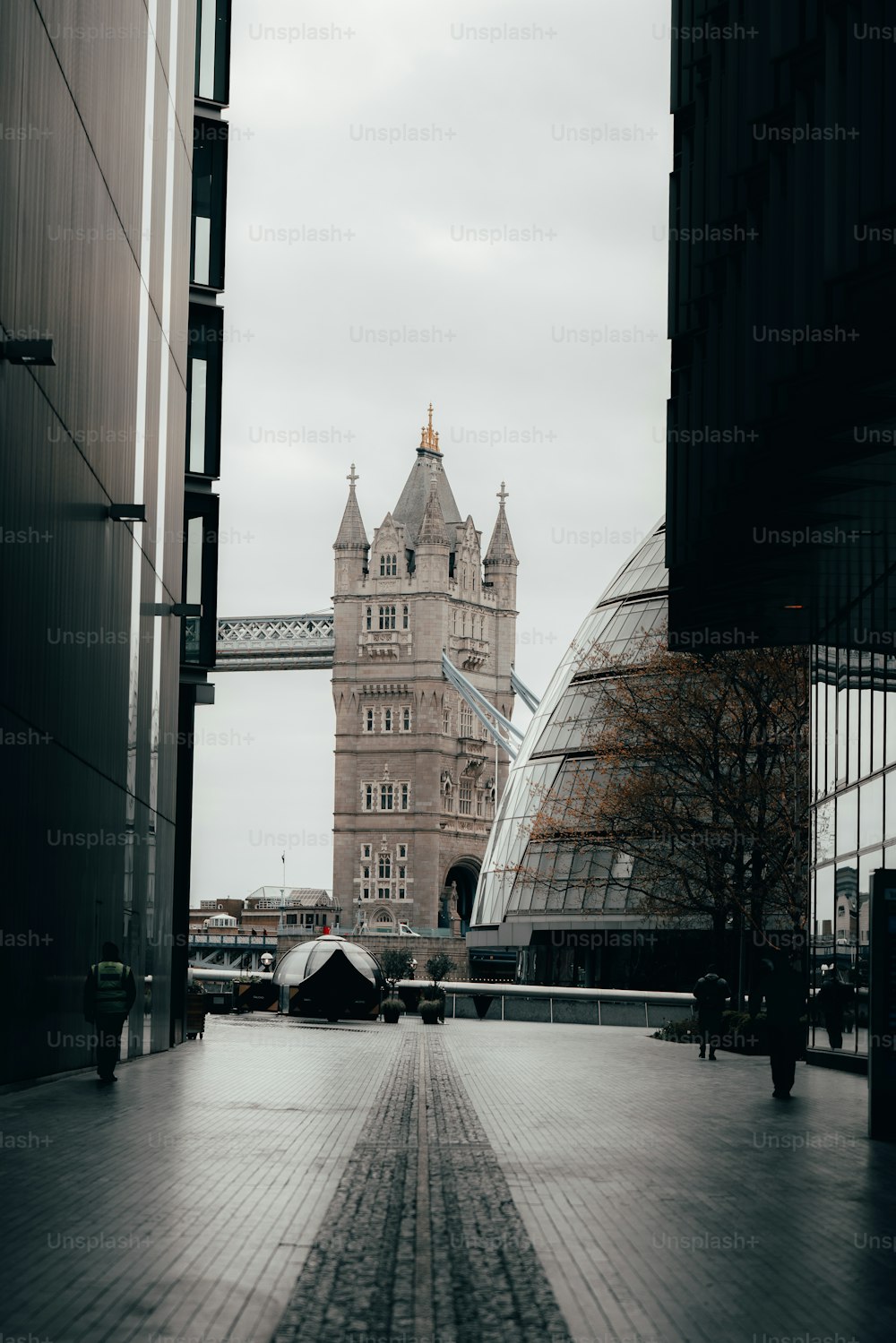 a view of the tower bridge from a walkway