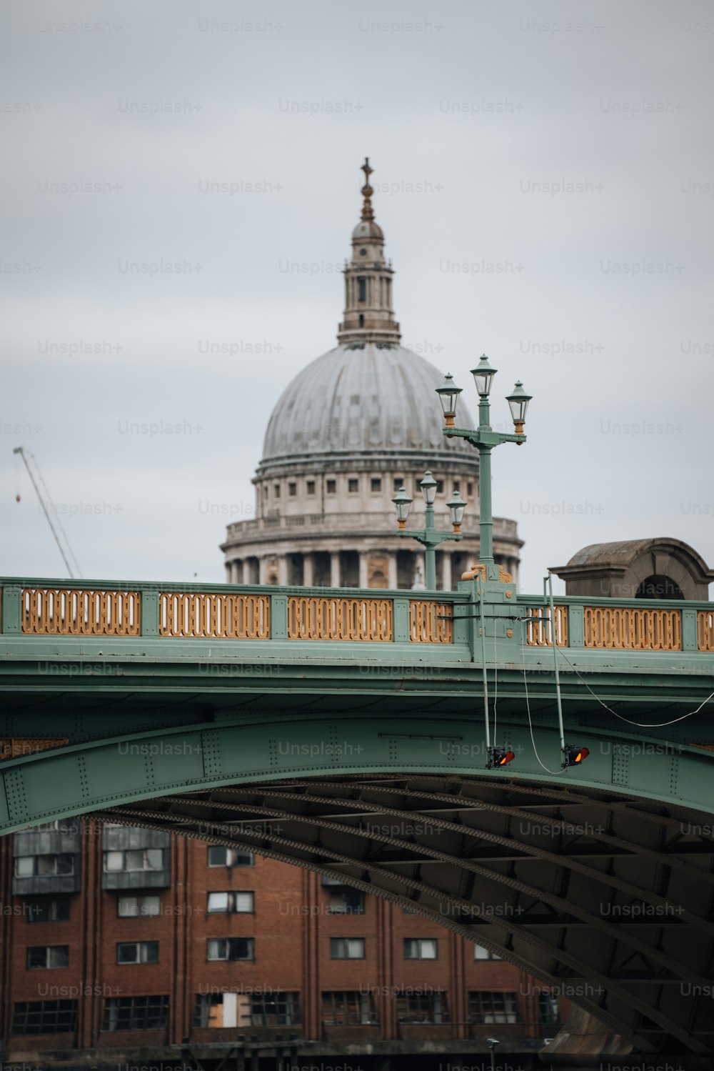 a bridge with a building in the background