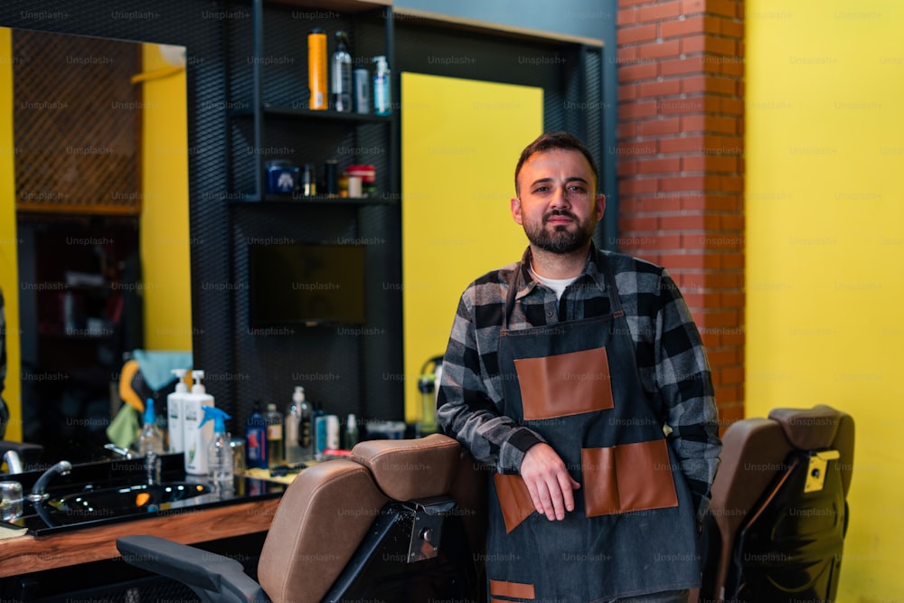 a man in a barbershop standing next to a chair
