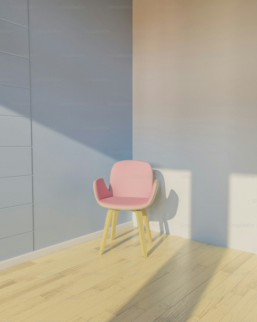 a pink chair sitting on top of a hard wood floor