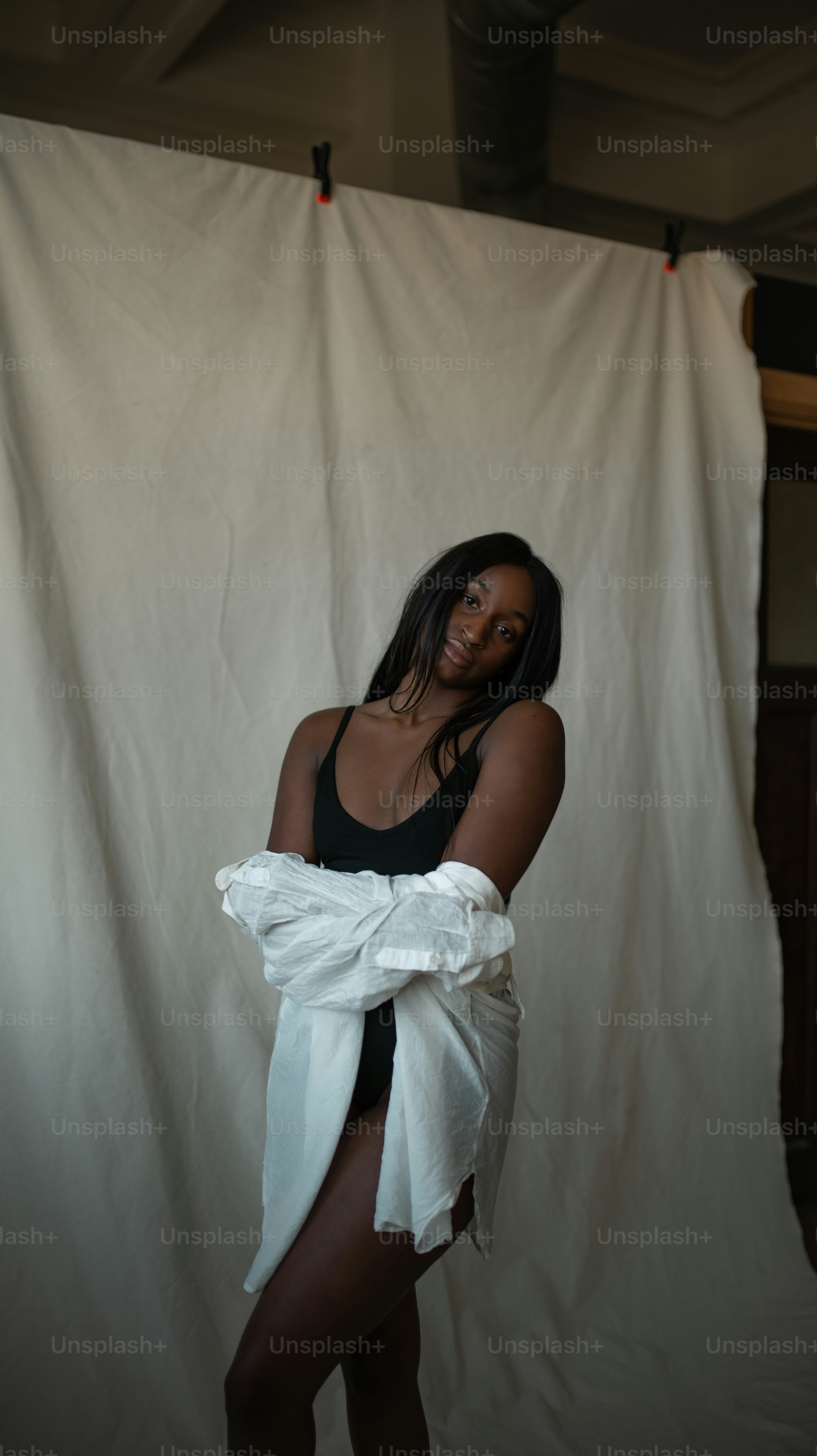 a woman in a black and white bathing suit