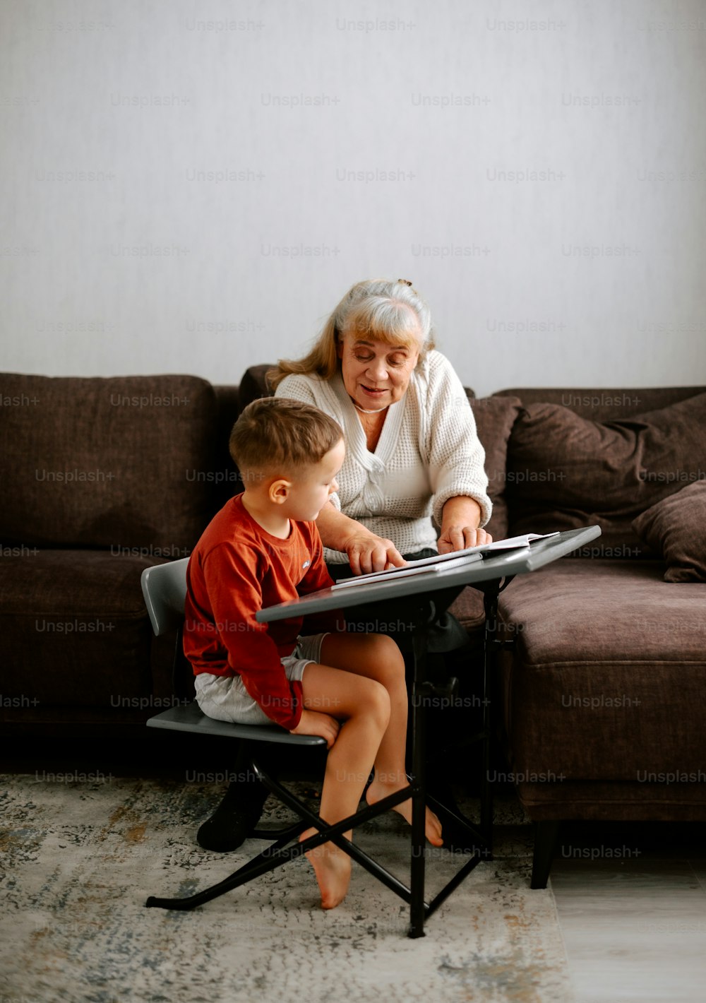 a woman sitting on a couch with a child
