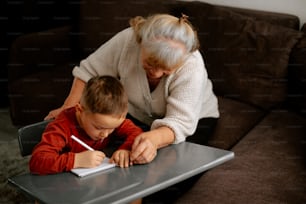 a woman and a child sitting at a table